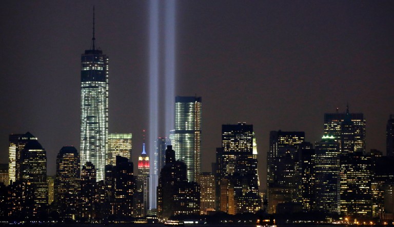In this Wednesday, Sept. 11, 2013, file photo, the twin beams of the annual Tribute in Light commemorating the Sept. 11, 2001, terrorist attacks shine amid the city's skyline, in New York.