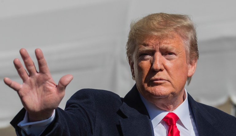 President Donald Trump waves after speaking to reporters upon arrival at the White House in Washington, Sunday, Nov. 3, 2019. 
