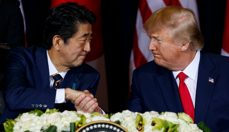 President Donald Trump shakes hands with Japanese Prime Minister Shinzo Abe before signing an agreement on trade at the InterContinental Barclay New York hotel during the United Nations General Assembly, Wednesday, Sept. 25, 2019, in New York.