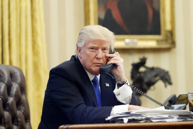 President Trump speaks on the phone with Prime Minister of Australia Malcolm Turnbull in the Oval Office of the White House on Jan. 28, 2017.