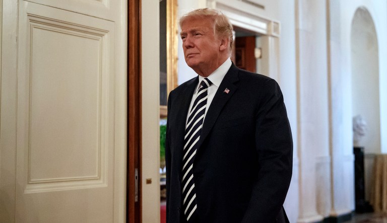 President Donald Trump arrives to present Mandy Manning, a teacher at the Newcomer Center at Joel E. Ferris High School in Spokane, Wash., with the National Teacher of the Year award during a reception in the East Room of the White House in Washington, Wednesday, May 2, 2018.