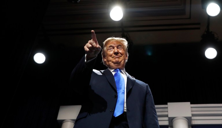 President Donald Trump smiles and points at Republican mega-donor Sheldon Adelson, as Trump arrives to speak at the Republican Jewish Coalition's annual leadership meeting, Saturday April 6, 2019, in Las Vegas.