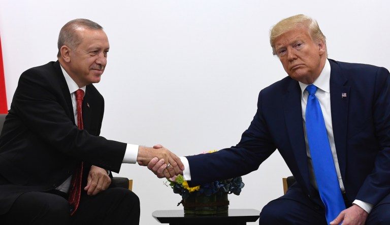 President Donald Trump, right, shakes hands with Turkish President Recep Tayyip Erdogan, left, during a meeting on the sidelines of the G-20 summit in Osaka, Japan, Saturday, June 29, 2019. 