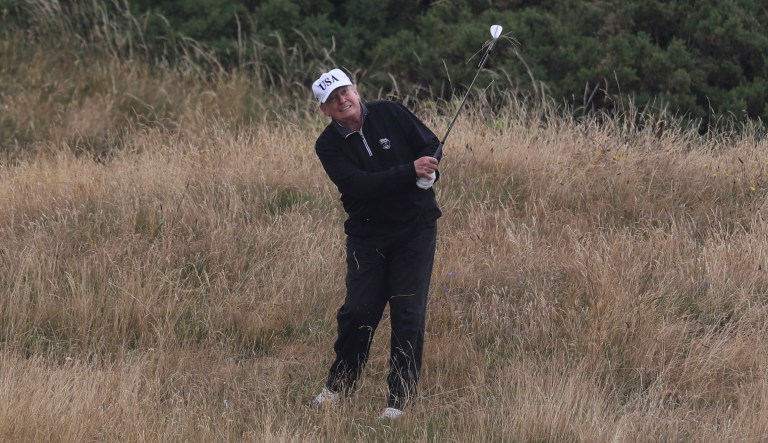 U.S. President Donald Trump plays golf at Turnberry golf club, in Turnberry, Scotland, Sunday, July 15, 2018. President Trump and the First Lady spent the weekend in Scotland, as part of their visit to the UK before leaving for Finland where he will meet Russian leader Vladimir Putin for talks on Monday.