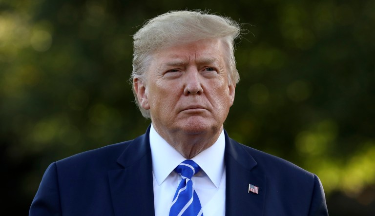 President Donald Trump talks with reporters on the South Lawn of the White House in Washington, Friday, Aug. 30, 2019, before heading to Camp David.