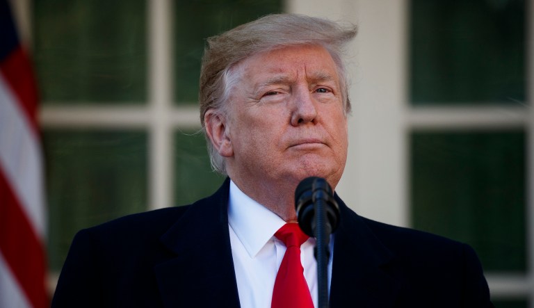 President Donald Trump announces a deal to temporarily reopen the government, in the Rose Garden of the White House, Friday, Jan. 25, 2019, in Washington.