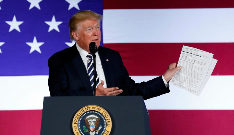 In this Aug. 31, 2018, photo, President Donald Trump holds up a list of his administrations accomplishments while speaking at a Republican fundraiser at the Carmel Country Club in in Charlotte, N.C.  President Donald Trump is starting his Labor Day with an attack on a top union leader. Trump tweeted Monday that AFL-CIO President Richard Trumka ârepresented his union poorly on television this weekend.â He added: âit is easy to see why unions are doing so poorly. A Dem!â Trumka appeared on âFox News Sunday,â where he said efforts to overhaul the North American Free Trade Agreement should include Canada.
