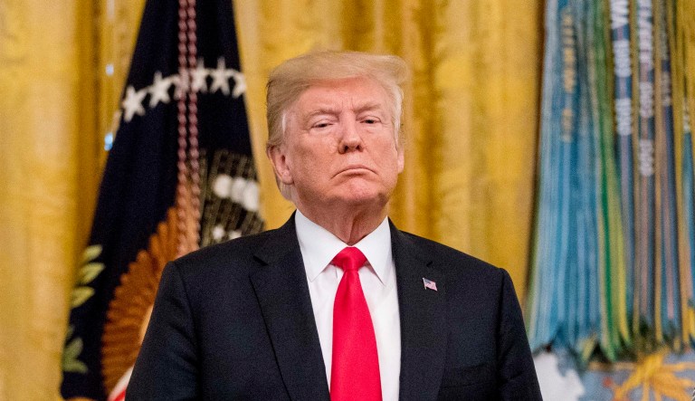 Valerie Nessel, left, stands with President Donald Trump before accepting the Medal of Honor for her husband Air Force Tech. Sgt. John A. Chapman, posthumously for conspicuous gallantry during a ceremony in the East Room of the White House in Washington, Wednesday, Aug. 22, 2018.
