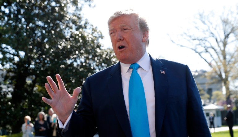 President Donald Trump speaks to members of the media on the South Lawn of the White House in Washington, before boarding Marine One helicopter, Wednesday, April 10, 2019.