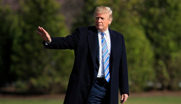 President Donald Trump walks across the South Lawn of the White House in Washington, Friday, March 23, 2018, as he heads to Marine One for a short trip to Andrews Air Force Base. Trump is heading to Florida where he will spend the weekend at the Mar-a-Lago estate.