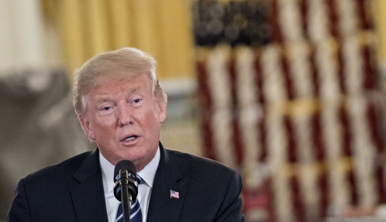 U.S. President Donald Trump speaks during a "Made in America" products showcase in the Cross Hall of the White House in Washington, D.C., U.S., on Monday, July 23, 2018. Trump is considering revoking the security clearances of former FBI Director James Comey, ex-CIA Director John Brennan and other Obama-era national security officials who have criticized him.