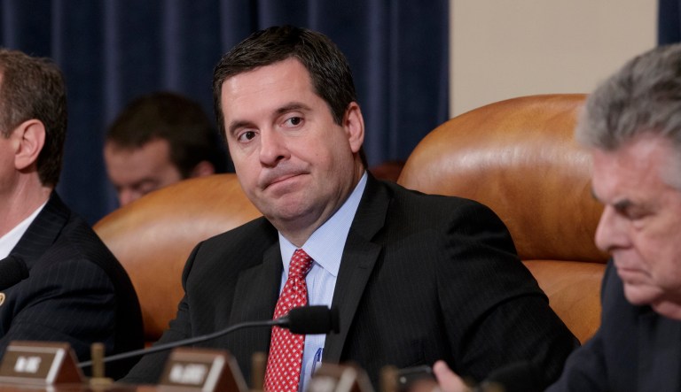 House Intelligence Committee Chairman Rep. Devin Nunes, R-Calif., center, flanked by the committee's ranking member Rep. Adam Schiff, D-Calif., left, and Rep. Peter King, R-N.Y., listens on Capitol Hill in Washington, Monday, March 20, 2017, during the committee's hearing on allegations of Russian interference in the 2016 U.S. presidential election.