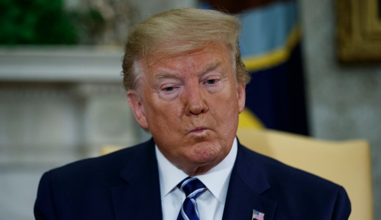 President Donald Trump listens to a question during a meeting with Canadian Prime Minister Justin Trudeau in the Oval Office of the White House, Thursday, June 20, 2019, in Washington.