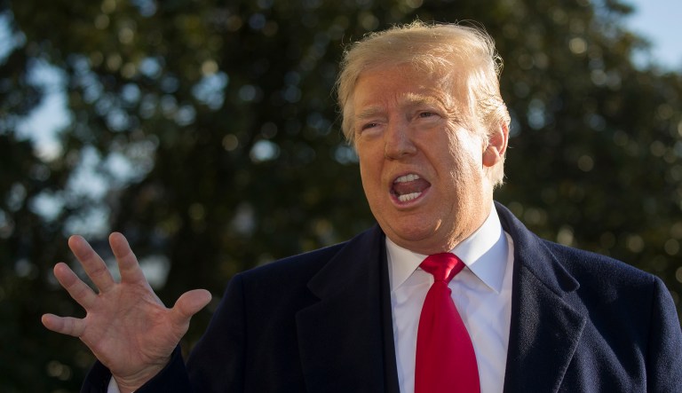President Donald Trump speaks on the South Lawn of the White House as he walks to Marine One, Sunday, Jan. 6, 2019, in Washington. Trump is en route to Camp David.
