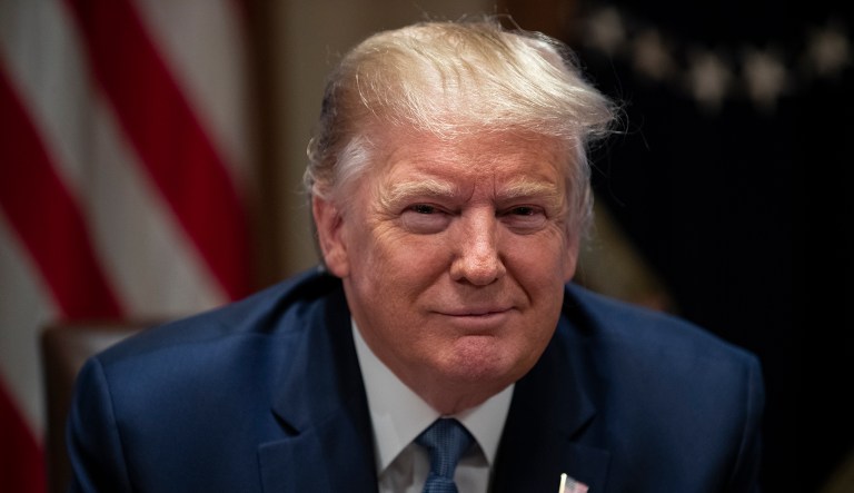 President Donald Trump smiles during a roundtable with governors on government regulations in the Cabinet Room of the White House, Monday, Dec. 16, 2019, in Washington.