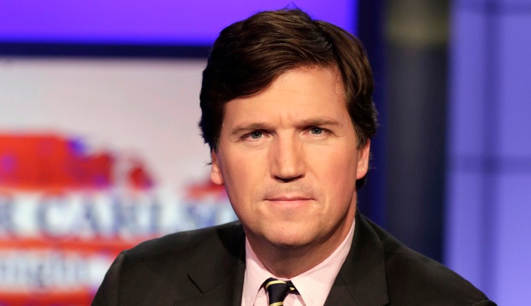 Tucker Carlson, host of "Tucker Carlson Tonight," poses for photos in a Fox News Channel studio, in New York, Thursday, March 2, 2107.