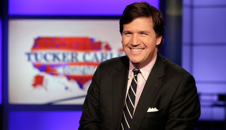 Tucker Carlson reacts during the final round of the Bedminster Invitational LIV Golf tournament in Bedminster, New Jersey on July 31, 2022.  