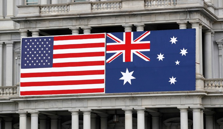 An American and Australian flag hang from the Eisenhower Executive Office Building on the grounds of the White House Complex in Washington, Tuesday, Sept. 17, 2019, ahead of Australian Prime Minister Scott Morrison's state visit. President Donald Trump is scheduled to welcome Morrison to the White House Friday, Sept. 20.