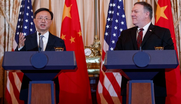Secretary of State Mike Pompeo looks to Chinese Politburo Member Yang Jiechi as he speaks during a news conference at the State Department in Washington, Friday, Nov. 9, 2018.