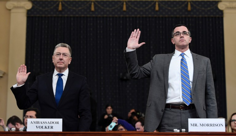 Ambassador Kurt Volker, left, former special envoy to Ukraine, and Tim Morrison, a former official at the National Security Council are sworn in to testify before the House Intelligence Committee on Capitol Hill in Washington, Tuesday, Nov. 19, 2019, during a public impeachment hearing of President Donald Trump's efforts to tie U.S. aid for Ukraine to investigations of his political opponents.