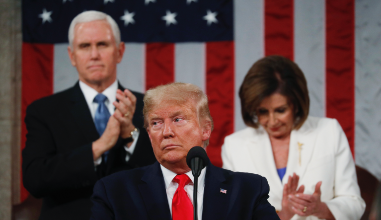 President Donald Trump delivers his State of the Union address to a joint session of Congress in the House Chamber on Capitol Hill in Washington, Tuesday, Feb. 4, 2020, as Vice President Mike Pence and Speaker Nancy Pelosi look on. (Leah Millis/Pool via AP)