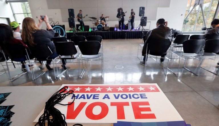 A small crowd watches the band Gypsy Temple during a performance by the group urging youth to participate in the November election at Shoreline Community College Thursday, Oct. 25, 2018, in Shoreline, Wash.
