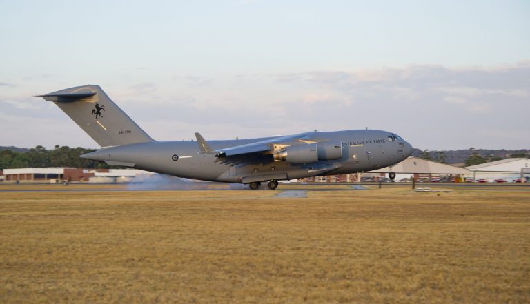 In this Friday, March 28, 2014 photo released by the Australian Defence, a Royal Australian Air Force C-17 Globemaster arrives to help with the search for the missing Malaysia Airlines Flight 370 at RAAF Pearce Base in Perth, Australia. Objects spotted floating in a new search area for debris from the missing Malaysian jetliner need to be recovered and inspected before they can be linked to the plane, Australian officials said Saturday. Eight planes were ready to comb the newly targeted area off the west coast of Australia after several objects were spotted Friday, including two rectangular items that were blue and gray, and ships on the scene will attempt to recover them, the Australian Maritime Safety Authority said. (AP Photo/Australian Defence, Justin Brown)