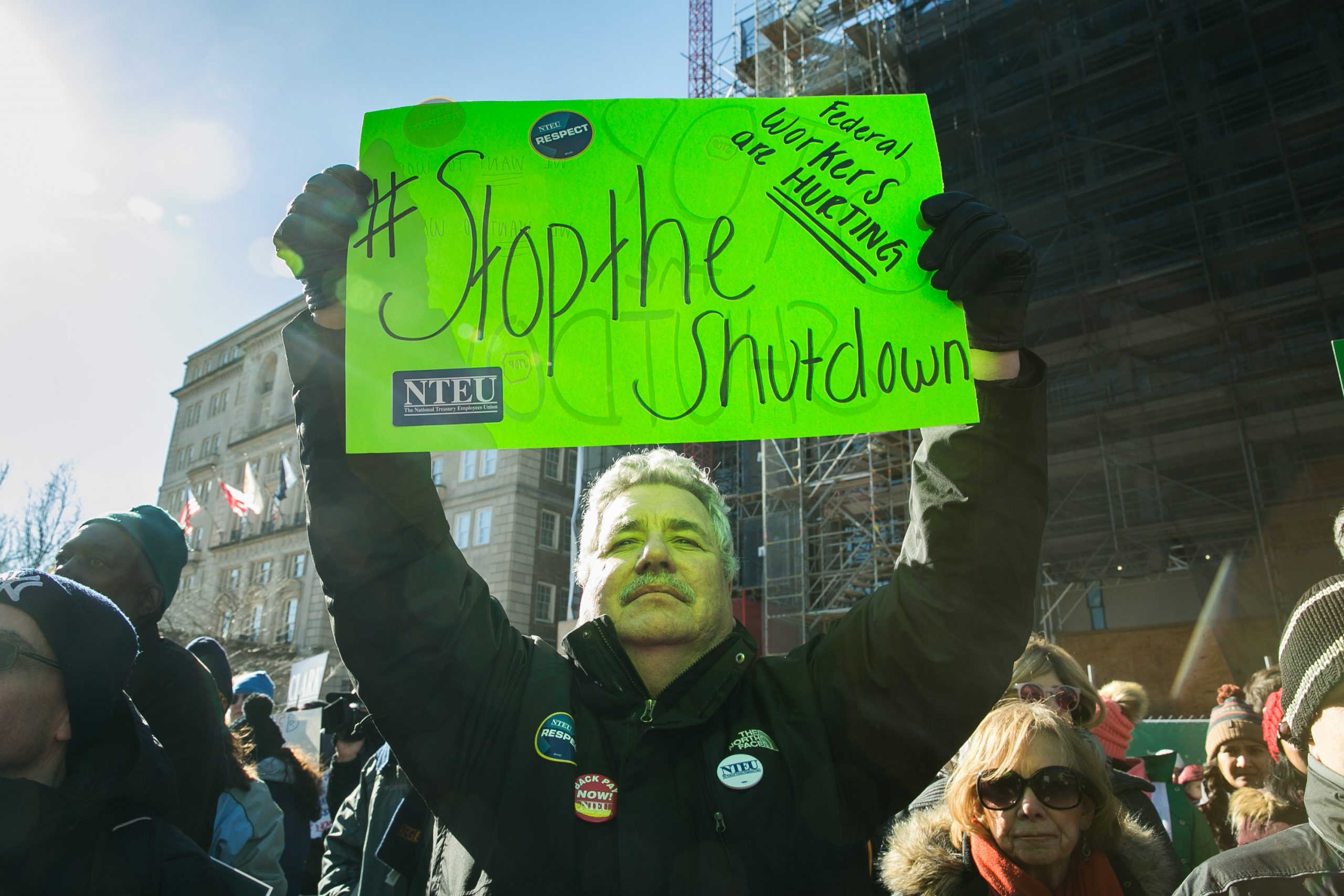 Union members and other federal employees rally to call for an end to the partial government shutdown on Thursday outside the White House. 