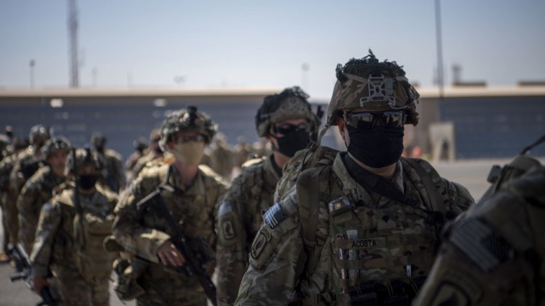 U.S. Army soldiers from the East African Response Force assigned to the Combined Joint Task Force - Horn of Africa prepare to board a C-130J Super Hercules Jan. 21, 2021, in Somalia.