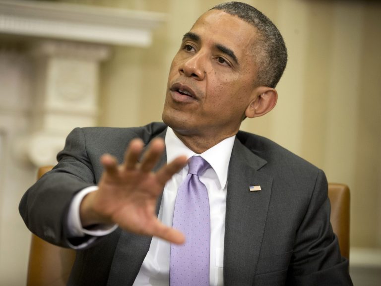 President Barack Obama answers questions on violence in Iraq during his meeting with Australian Prime Minister Tony Abbott, Thursday, June 12, 2014, in the Oval Office of the White House in Washington. Obama said that Iraq will need additional assistance from the U.S. to push back an Islamic insurgency. The president did not specify in a brief question-and-answer session what type of assistance he is willing to provide. But Obama did say the White House has not ruled anything out. He said he is watching the situation in Iraq with concern and wants to ensure that jihadists don't get a foothold. Iraq has been beset by violence since the last American forces withdrew in late 2011. The violence escalated this week with an al-Qaida-inspired group capturing two key Sunni-dominated cities this week and vowing to march on to Baghdad. (AP Photo/Pablo Martinez Monsivais)