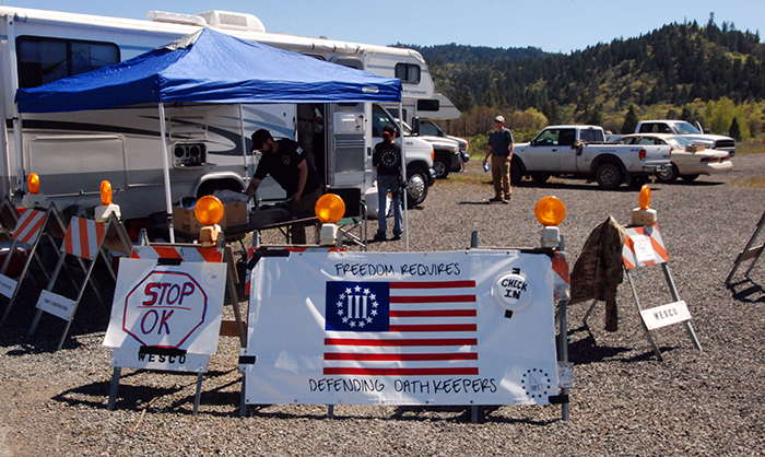 In April 2015, outside Grants Pass, Ore., a local chapter of the Oath Keepers recruited people to help provide security for a gold mine on federal land where the claimholders are in a dispute with federal regulators. (AP Photo/Jeff Barnard)