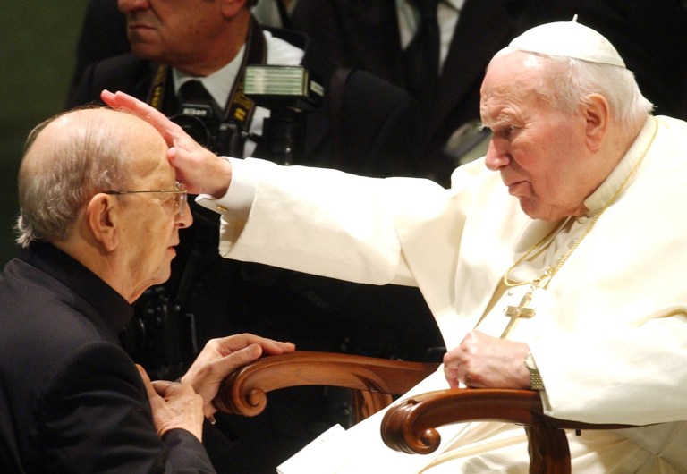 FILE - In this Nov. 30, 2004 file photo,  Pope John Paul II gives his blessing to late father Marcial Maciel, founder of Christ's Legionaries, during a special audience the pontiff granted to about four thousand participants of the Regnum Christi movement, at the Vatican. Pope John Paul II is rightly credited with having helped bring down communism, of inspiring a new generation of Catholics with a globe-trotting papacy and of explaining church teaching on a range of hot-button issues as Christianity entered its third millennium. But the sexual abuse scandal that festered under his watch remains a stain on his legacy. John Paul and his top advisers failed to grasp the severity of the abuse problem until very late in his 26-year papacy, even though U.S. bishops had been petitioning the Holy See since the late-1980s for a faster way to defrock pedophile priests. (AP Photo/Plinio Lepri, File)