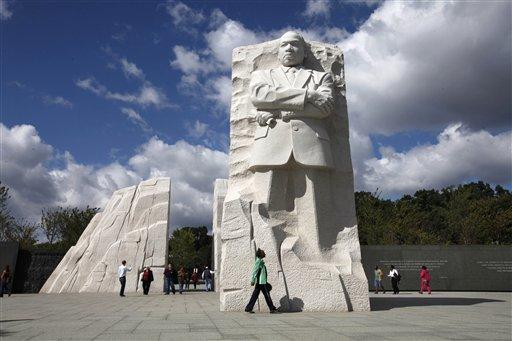 A visitor walks through the Martin Luther King, Jr. Memorial in Washington, Tuesday, Oct. 4, 2011. The rescheduled dedication of the newest addition to the National Mall is set for Oct. 16. 