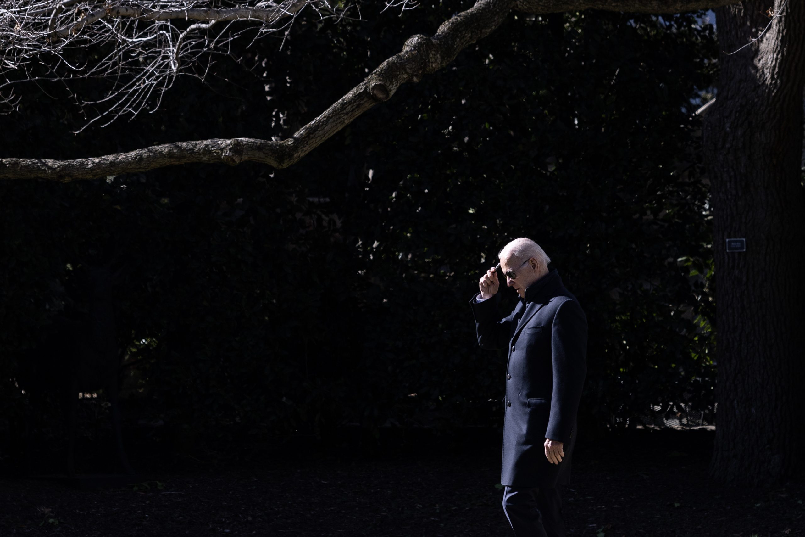 U.S. President Joe Biden scratches his head with a pen as he departs the White House on February 03, 2023 DC. Biden is traveling to Philadelphia to speak about his administration's economic policy. 