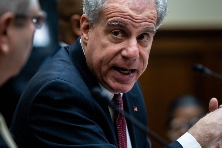 Michael Horowitz, chair of the Pandemic Response Accountability Committee, looks towards David M.Smith assistant director of the U.S. Secret Service's Office Investigations, during a House Oversight and Reform Committee hearing on Capitol Hill, on February 1, 2023 in Washington, DC. The committee held the hearing to discuss COVID Pandemic Federal Spending
