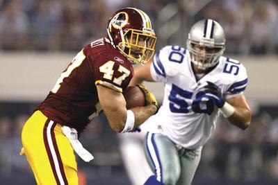 Tony Gutierrez/AP
Washington Redskins tight end Chris Cooley said he would like to meet Dallas Cowboys quarterback Tony Romo in a cage match.