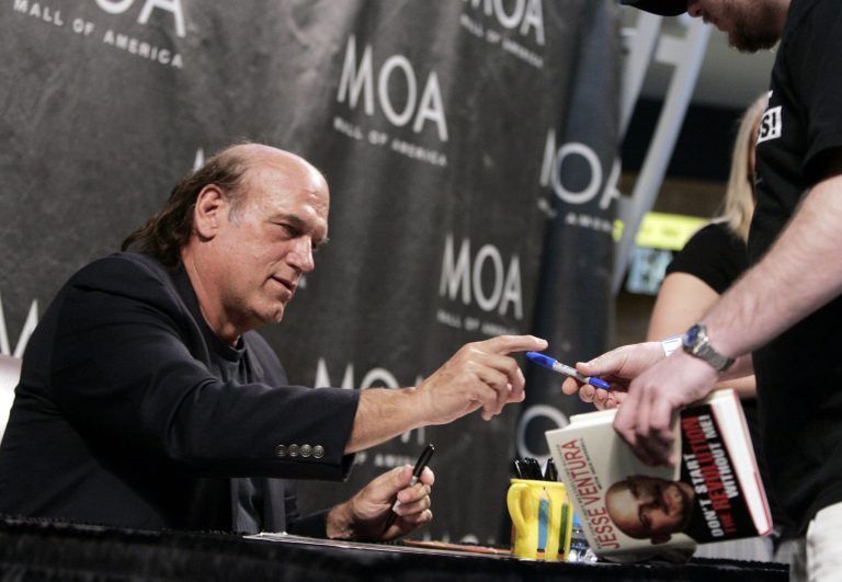 FILE - In this May 15, 2008 file photo, former Minnesota Gov. Jesse Ventura signs his new book, 