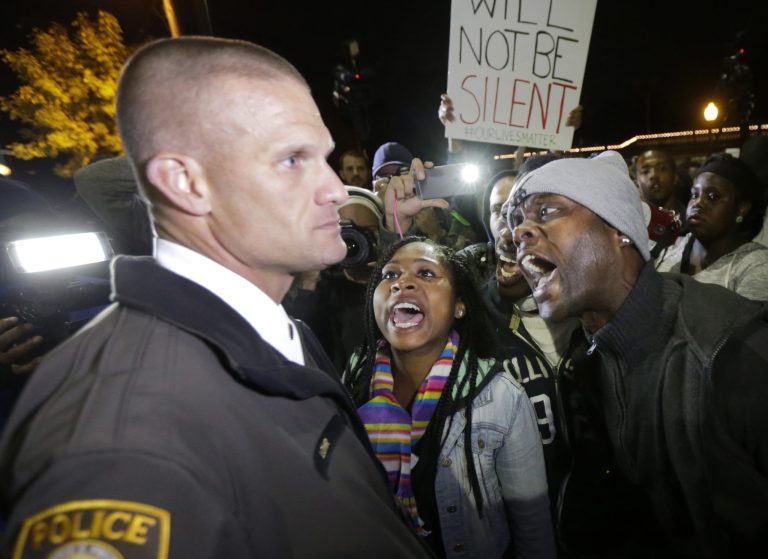 Around 86 percent of cops say their jobs are harder after high-profile encounters between police and blacks. (AP Photo/Charles Rex Arbogast)