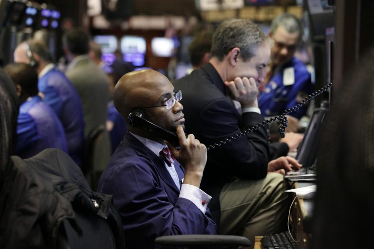   FILE - In this June 4, 2012, file photo, trader Lewis Vande Pallen, center, works on the floor of the New York Stock Exchange. US stock futures are sliding along with investor confidence in the ability of the worldâs economic leaders to unravel Europeâs worsening debt crisis. (AP Photo/Richard Drew, File)  