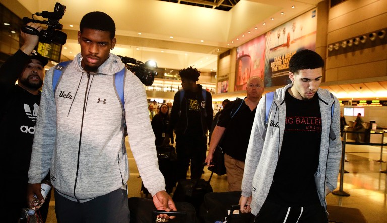UCLA basketball players Cody Riley, Jalen Hill, and LiAngelo Ball left the Los Angeles International Airport Tuesday after the three were detained in China on suspicion of shoplifting. (AP Photo/Jae C. Hong)