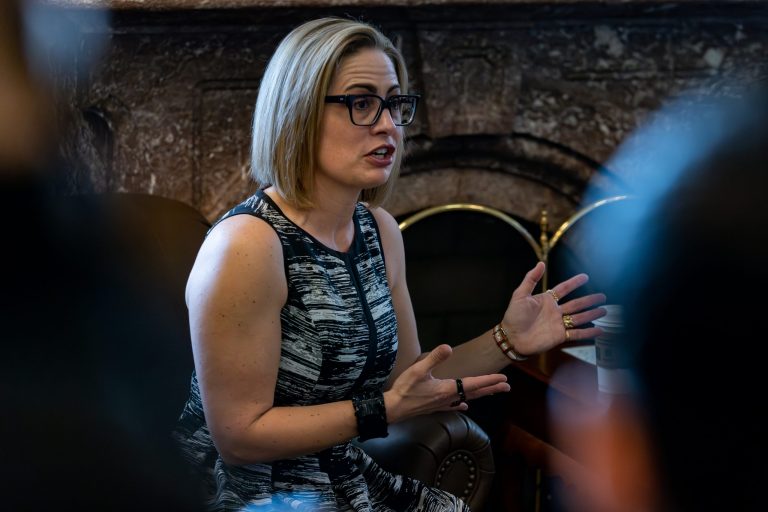 Sen. Kyrsten Sinema (I-AZ) speaks to members of the media on Title 42 at the Capitol in Washington on Thursday, May 11, 2023.