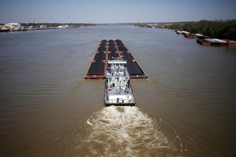 The towboat Janis R. Brewer pushes coal barges upstream on the Ohio River in Louisville, Kentucky. (Luke Sharrett/Bloomberg)