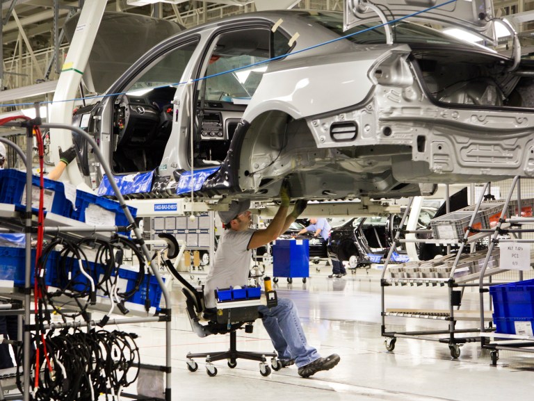 An employee works on a Passat sedan at the Volkswagen plant in Chattanooga, Tenn. (AP/Erik Schelzig)