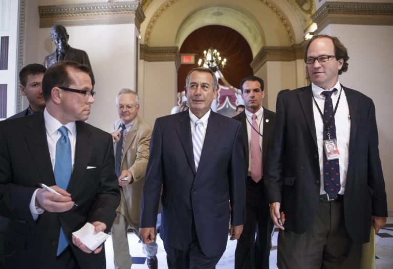 House Speaker John Boehner of Ohio walks to the House chamber on Capitol Hill in Washington, July 31, for final votes as Congress rushed for the doors and a five-week summer recess. Lawmakers have struggled to compromise on a handful of bills to deal with the nation's pressing problems amid overwhelming partisanship. (AP Photo/J. Scott Applewhite)