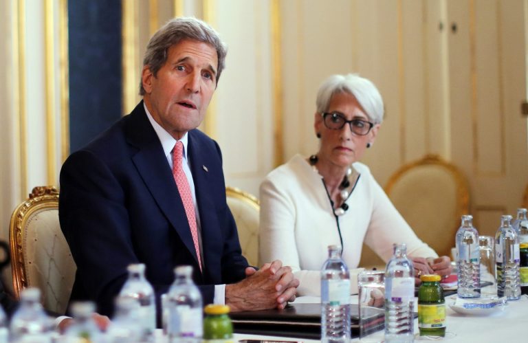 Secretary of State John Kerry, left, talks to reporters alongside Under Secretary for Political Affairs Wendy Sherman as they meet with the Iranian delegation at a hotel in Vienna, Austria, Saturday, June 27, 2015. (Carlos Barria/Pool Photo via AP)