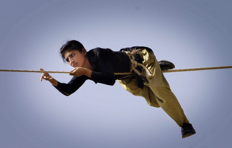 In this Wednesday, May 7, 2014 photo, A Pakistani police commando participates in a training session in Karachi, Pakistan. In a country where women have traditionally not worked outside the home and widespread huge discrimination, the appointments represent a significant step for women's empowerment. (AP Photo/Shakil Adil)