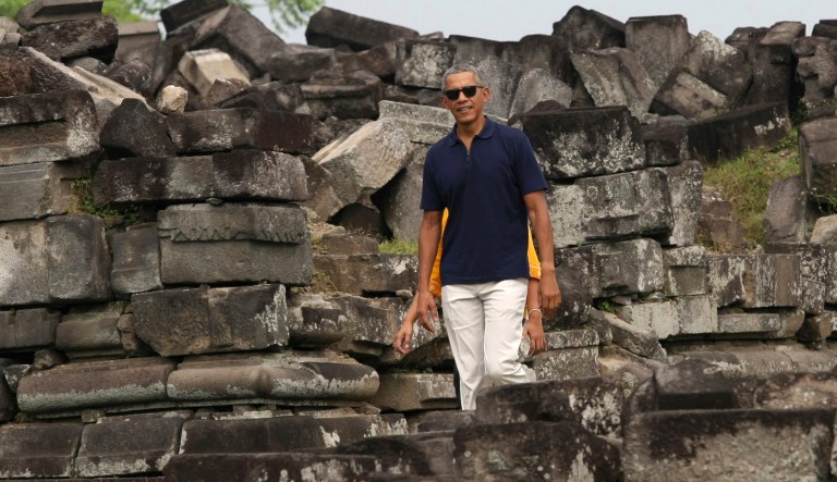 Former President Barack Obama walks during his visit to Prambanan Temple in Yogyakarta, Indonesia. Obama and his family are currently on vacation in the country where he lived for several years as a child. (AP Photo)