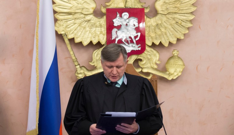 Russia's Supreme Court judge Yuri Ivanenko reads the decision in a court room in Moscow, Russia. Russia's Supreme Court has banned the Jehovah's Witnesses from operating in the country. (AP Photo/Ivan Sekretarev)
