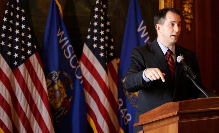 Wisconsin Gov. Scott Walker talks about his call for a special session of the state Legislature to delay shifting more than 100,000 Wisconsinites to the federal health insurance exchange during a press conference in Madison, Wis., on Nov. 14. (AP Photo/Wisconsin State Journal, M.P. King)