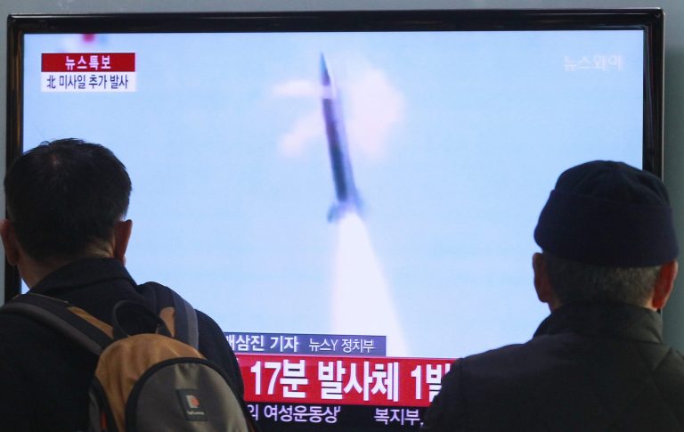 People watch TV reporting North Korea's missile test at Seoul Railway Station in Seoul, South Korea, Tuesday, March 4, 2014.  South Korea says North Korea has fired seven suspected artillery shells into the seas following its recent series of Scud missile launches. (AP Photo/Ahn Young-joon)